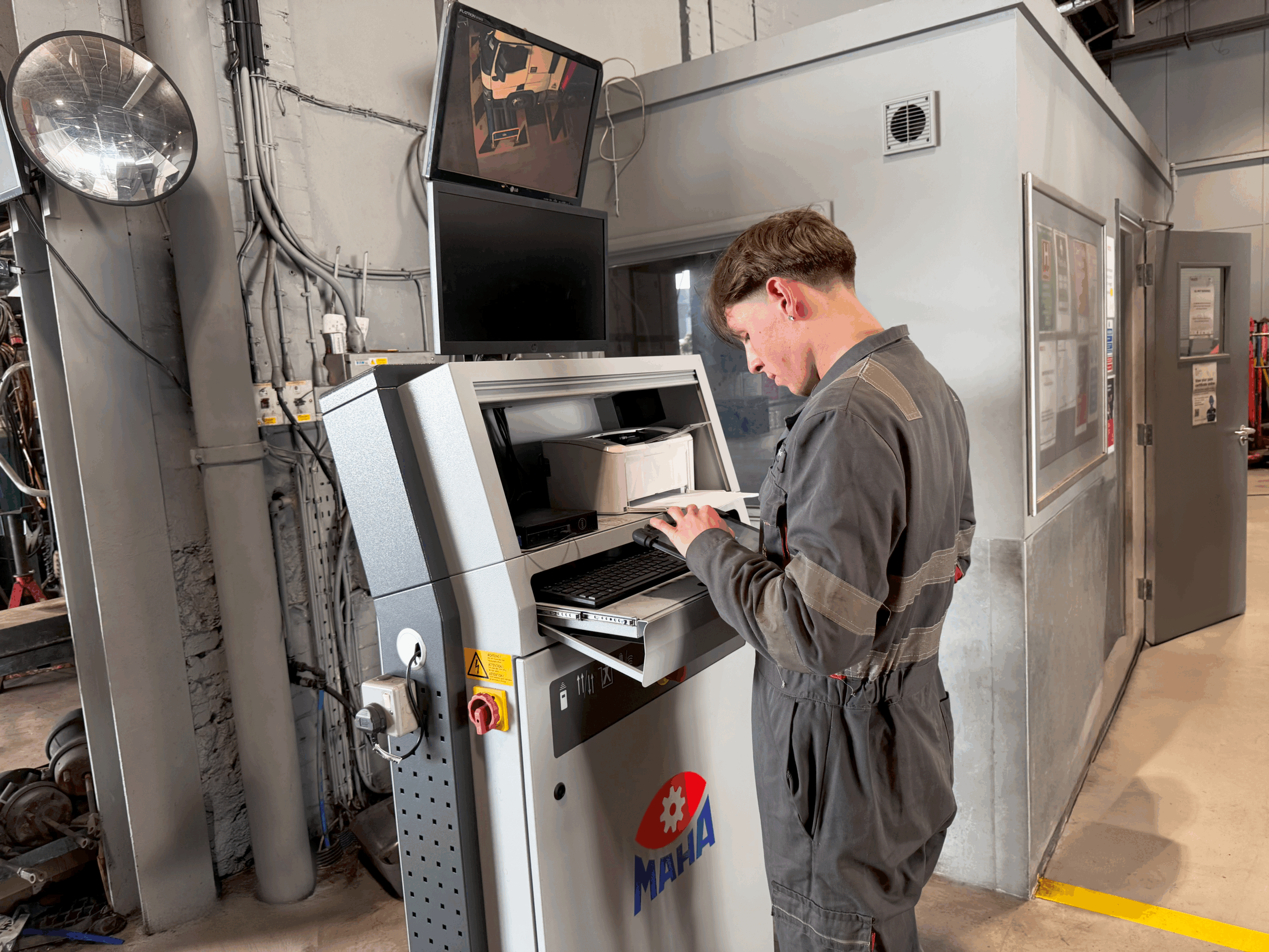 staff member using machinery at enfield depot