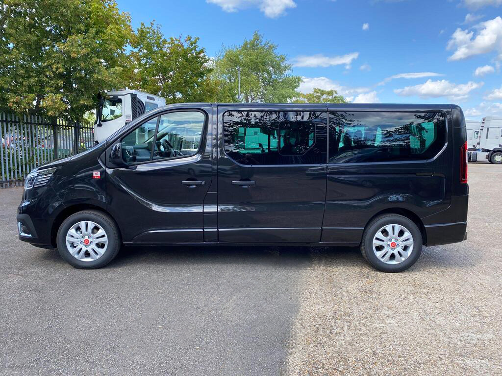 Side profile of black Renault Trucks Trafic 9-seat Combi minibus, ideal for private hire and shuttle work