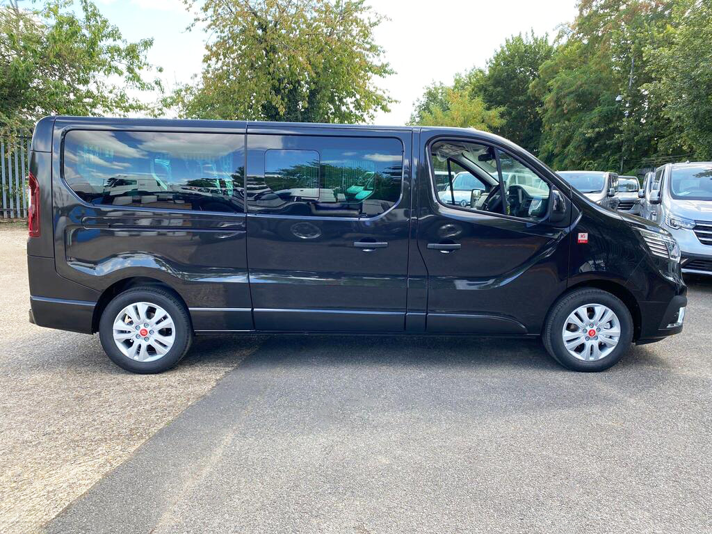 Side profile of black Renault Trucks Trafic 9-seat Combi minibus, ideal for private hire and shuttle work