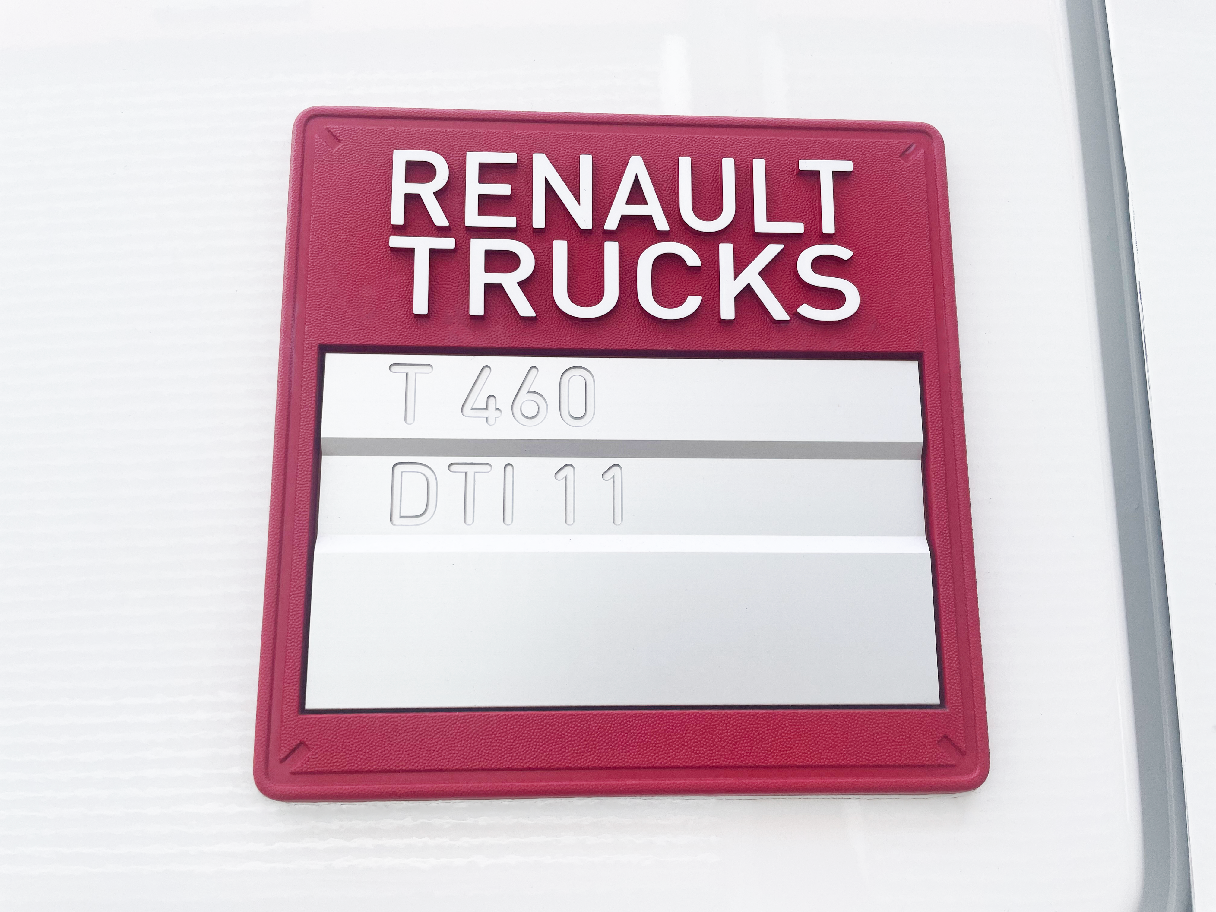 Close-up of DTI11 engine badge on Renault Trucks T 460, highlighting 11-litre diesel engine specification