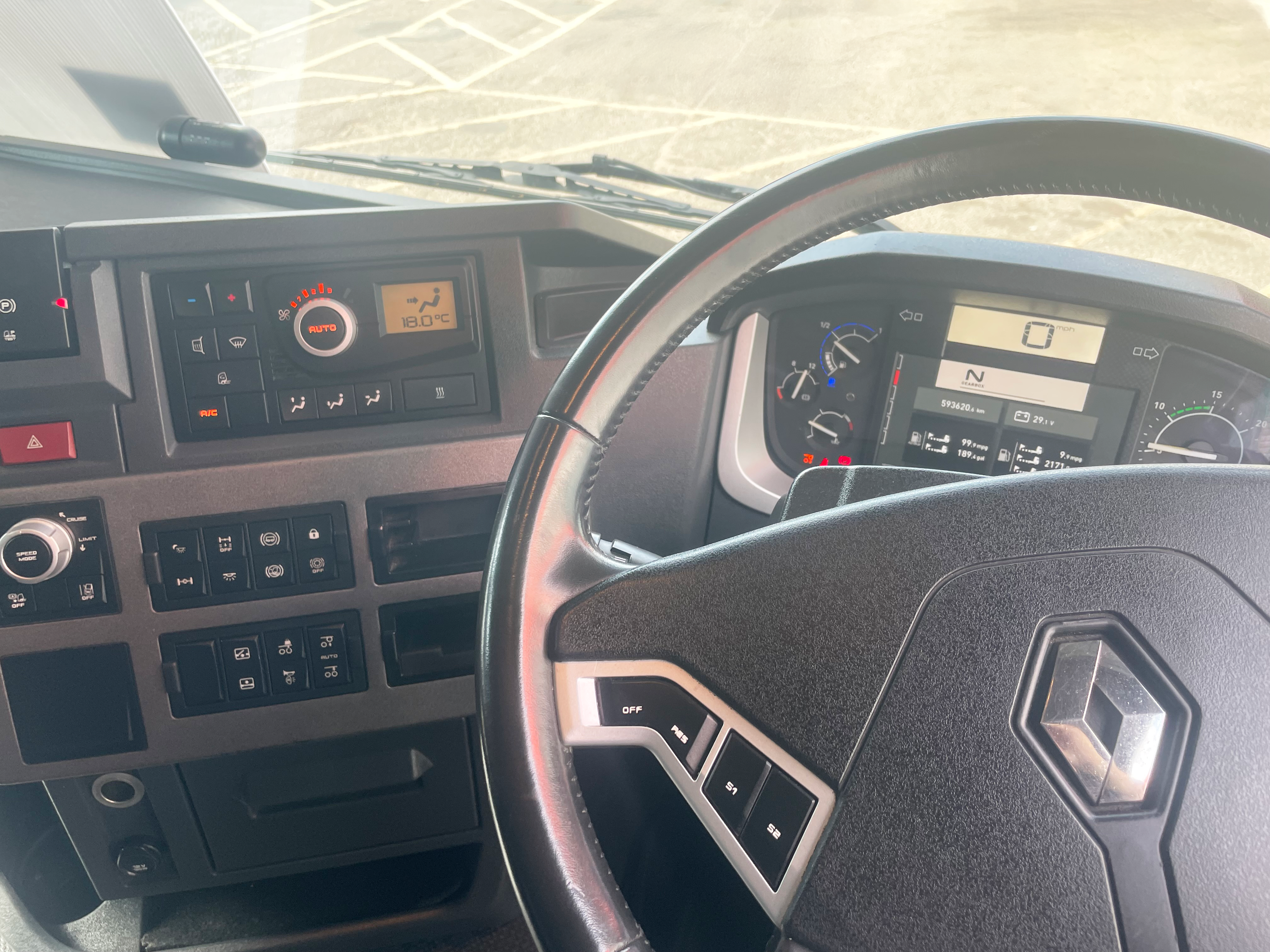 Renault Trucks T 460 interior showing dashboard and multifunction steering wheel from straight-on angle