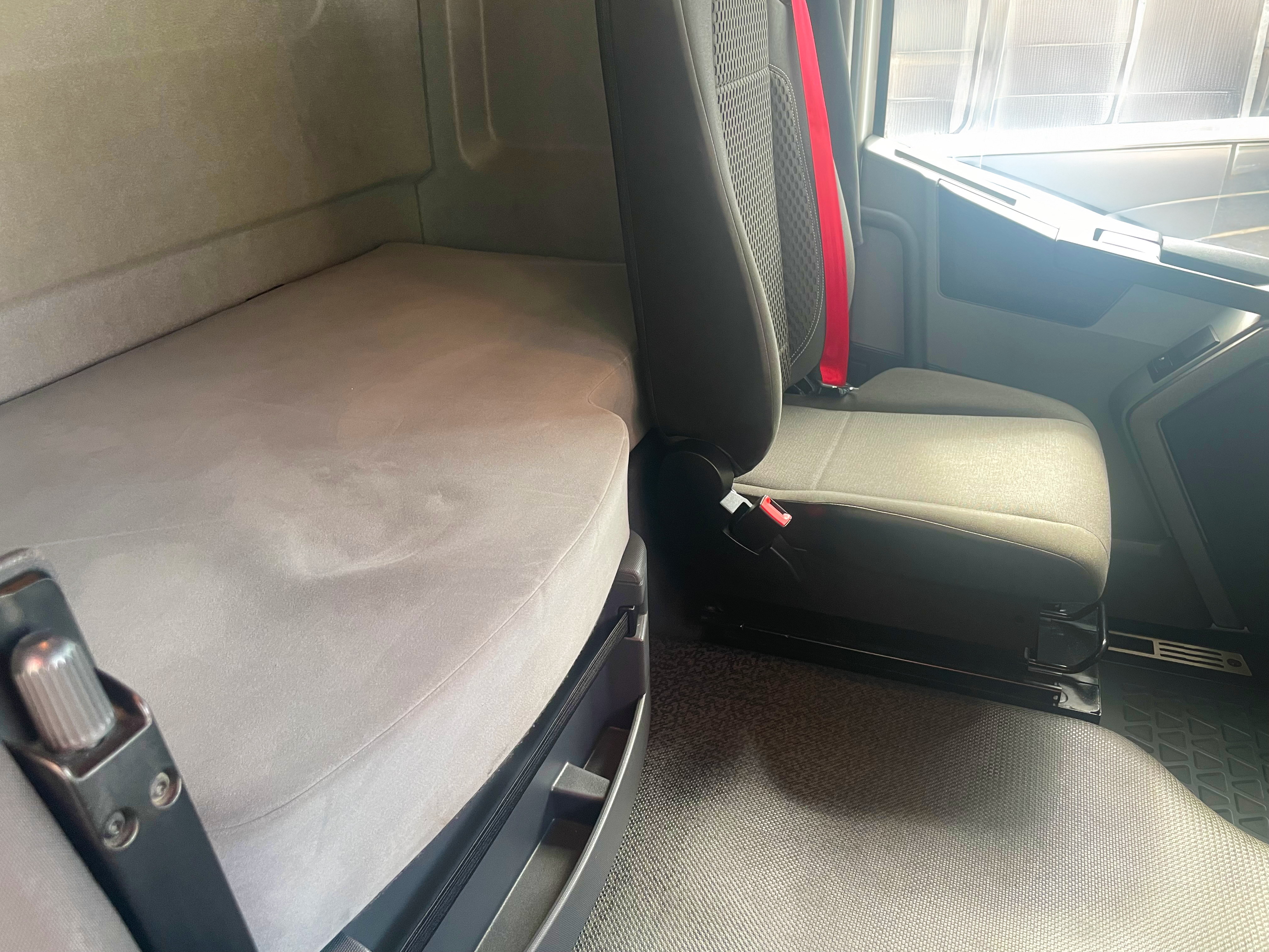 Renault Trucks T 460 sleeper cab interior with single bunk and comfortable seating for long-haul journeys