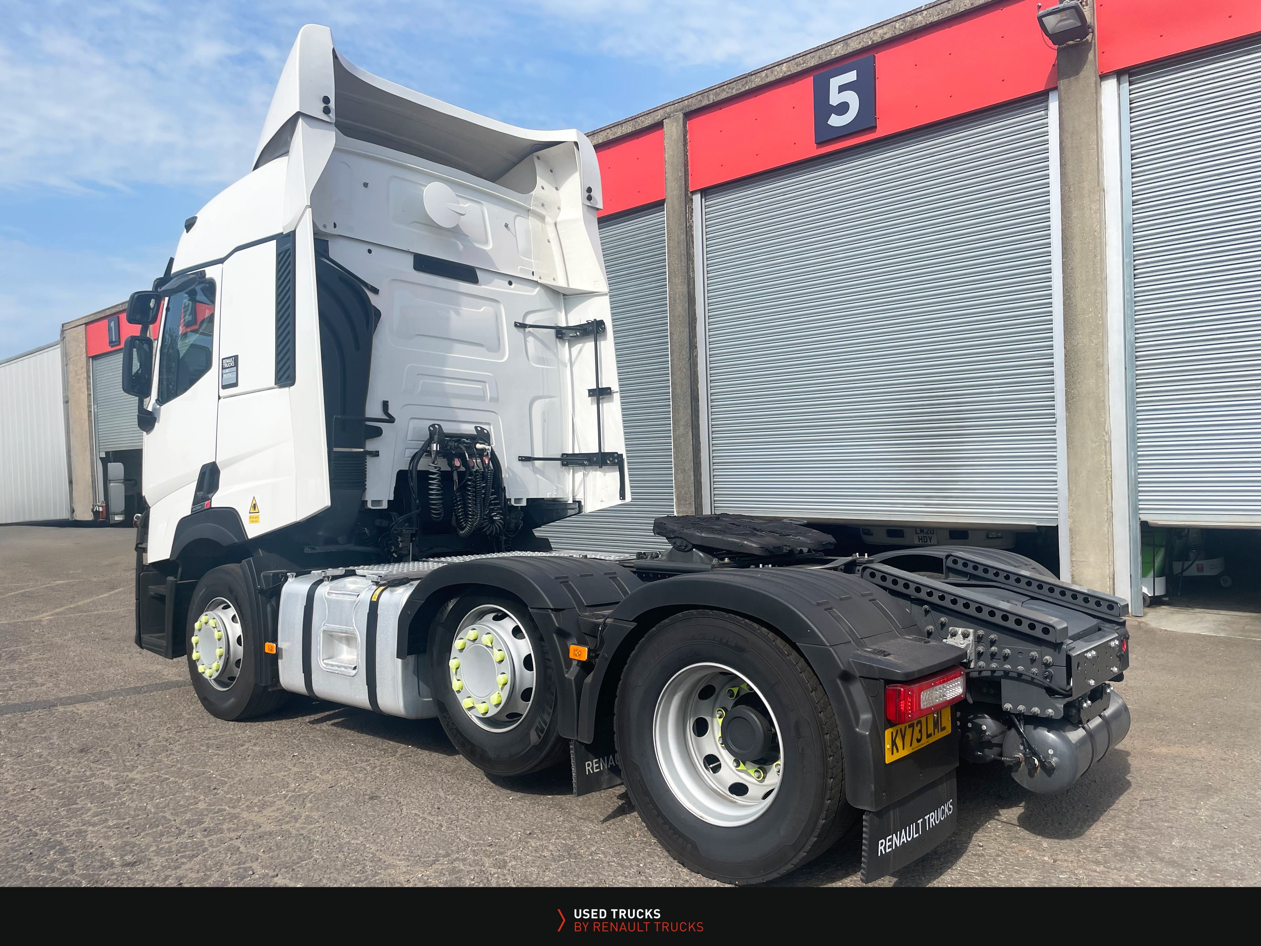 Renault Trucks T480 Turbo Compound 6x2 seen from rear left angle, showing chassis, mudguards, and tail lights.