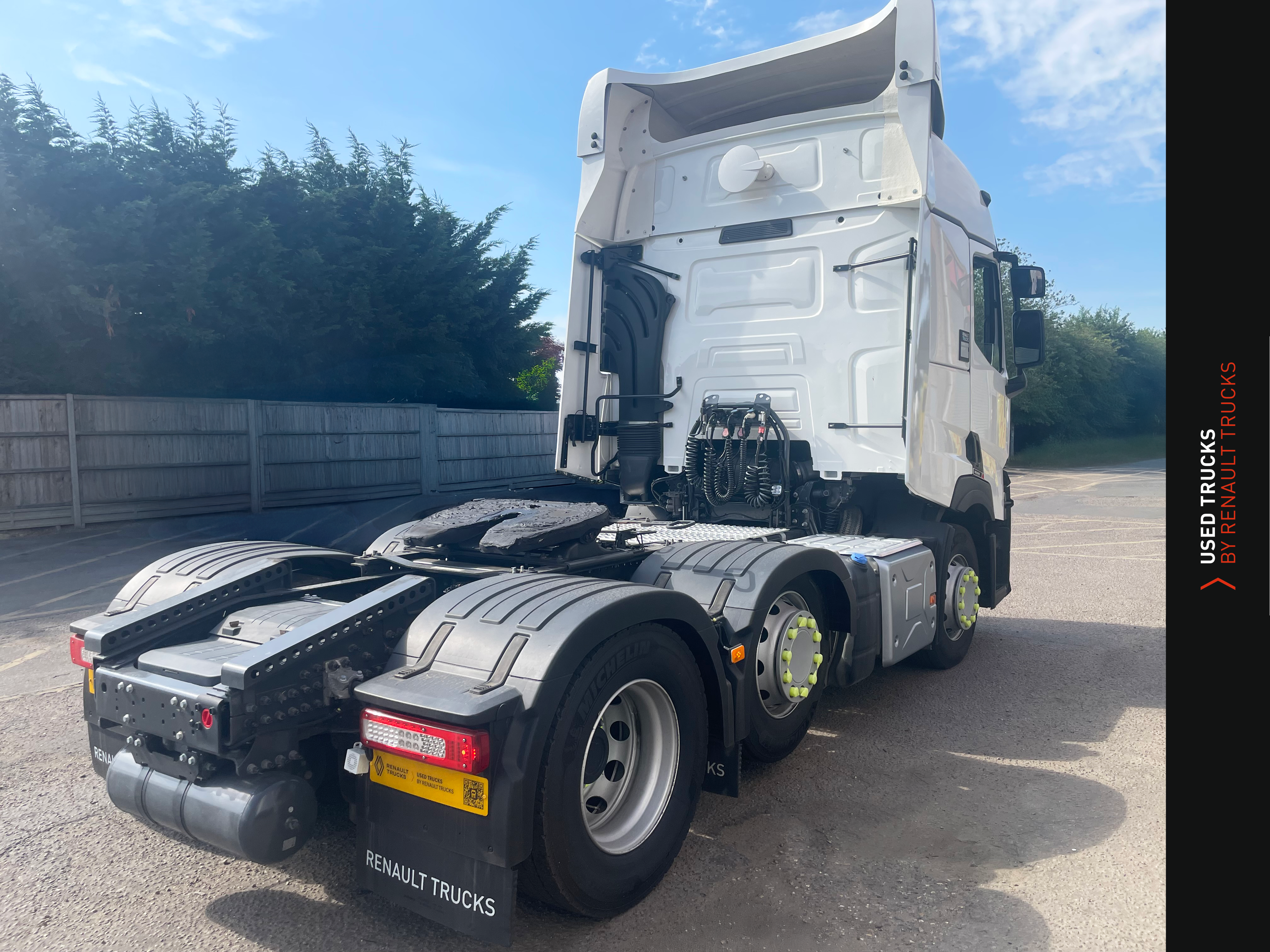 Used Renault T480 6x2 tractor unit from rear right, showing double axle configuration and side-mounted fuel tank.