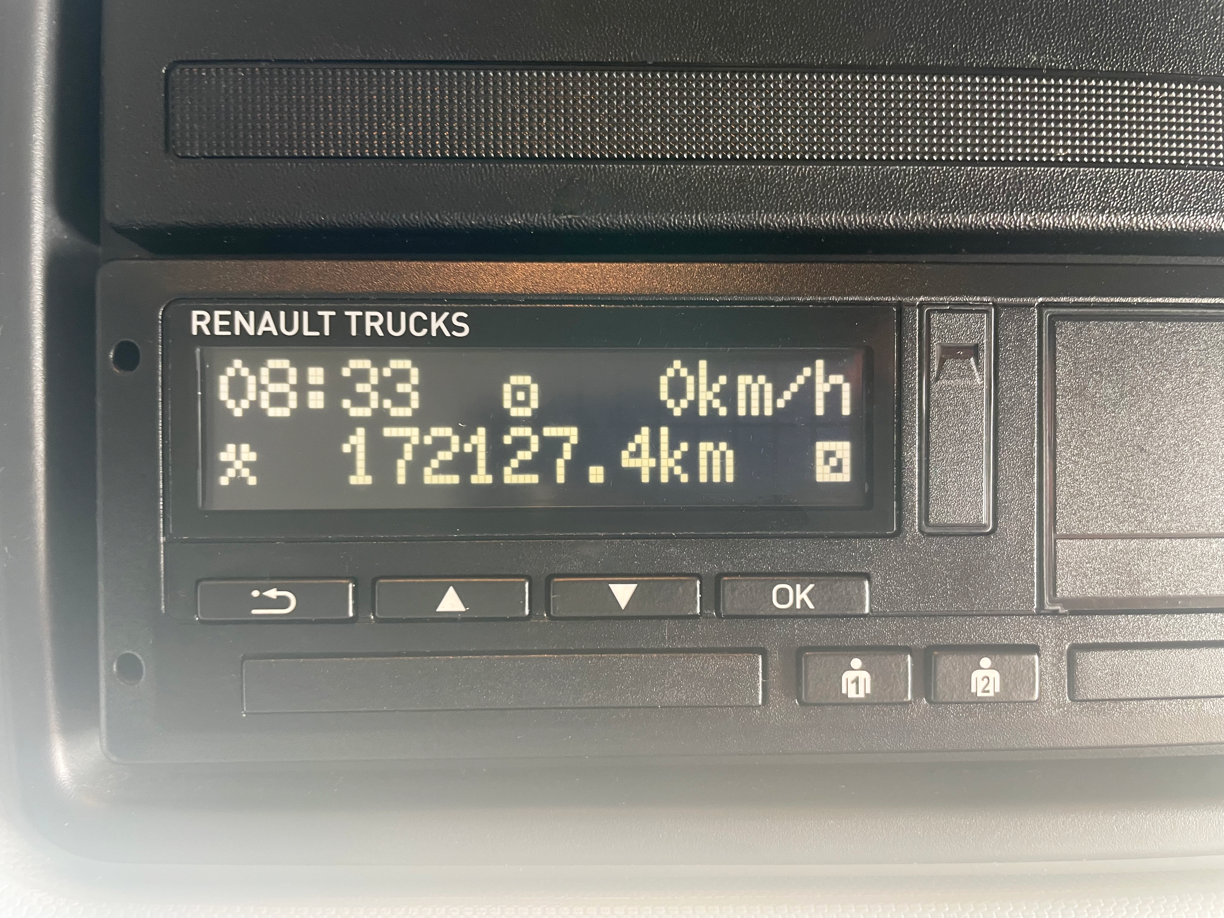 Tachograph and dashboard display in Renault Trucks T 6x2 Euro 6 cab, showing current time, speed, and mileage.