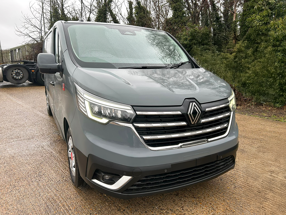 Front three-quarter view of Renault Trafic Red Edition panel van in Urban Grey