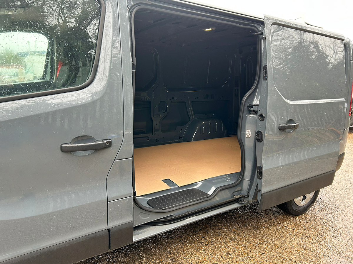 Renault Trafic Red Edition panel van with side sliding door open showing load access