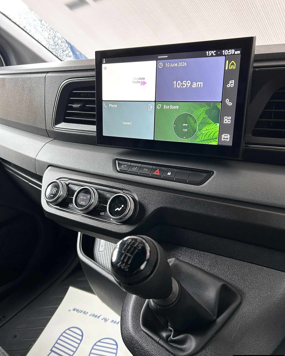 Renault Master dashboard with touchscreen infotainment system, climate controls and manual gearbox.