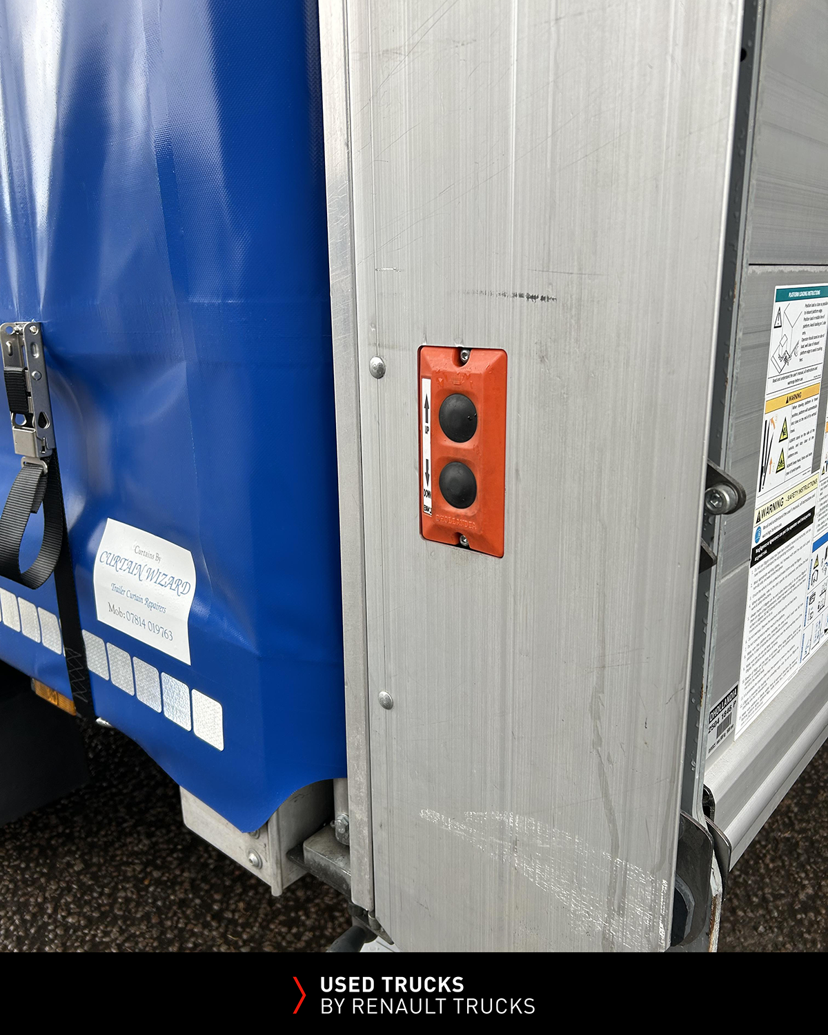 Close-up of Dhollandia tail lift control buttons fitted to a Renault Master curtainsider.