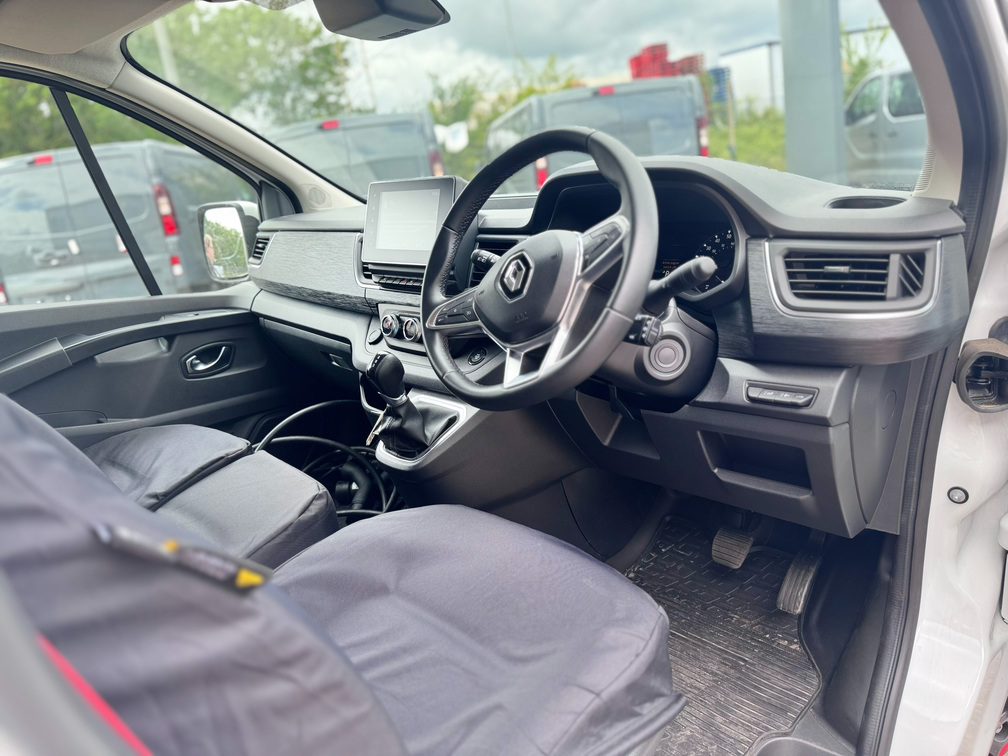 Driver cockpit of Renault Trucks E-Tech Trafic electric van showing steering wheel, dashboard and controls