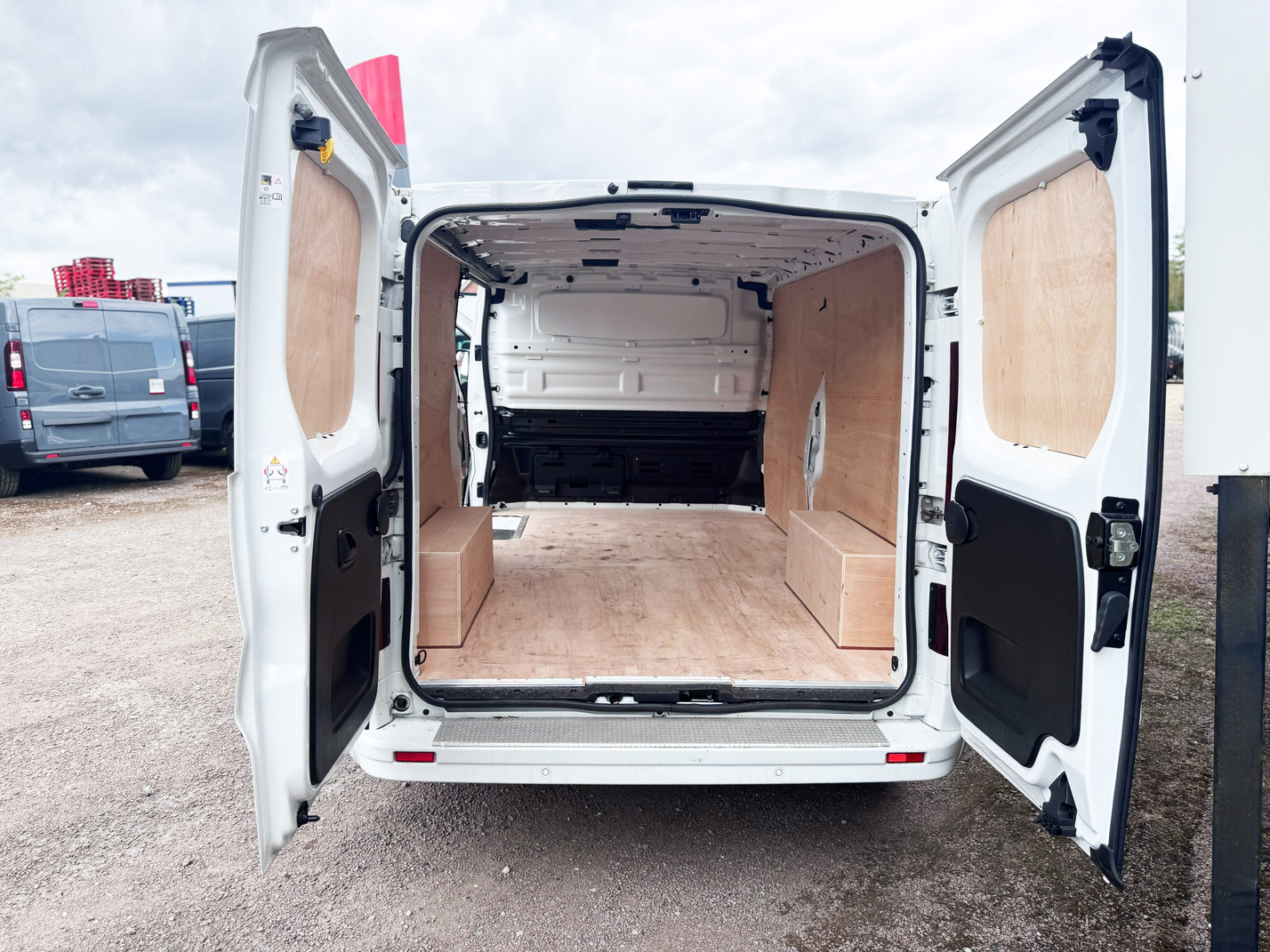 Rear cargo area of Renault Trucks E-Tech Trafic electric van with rear doors open showing load capacity