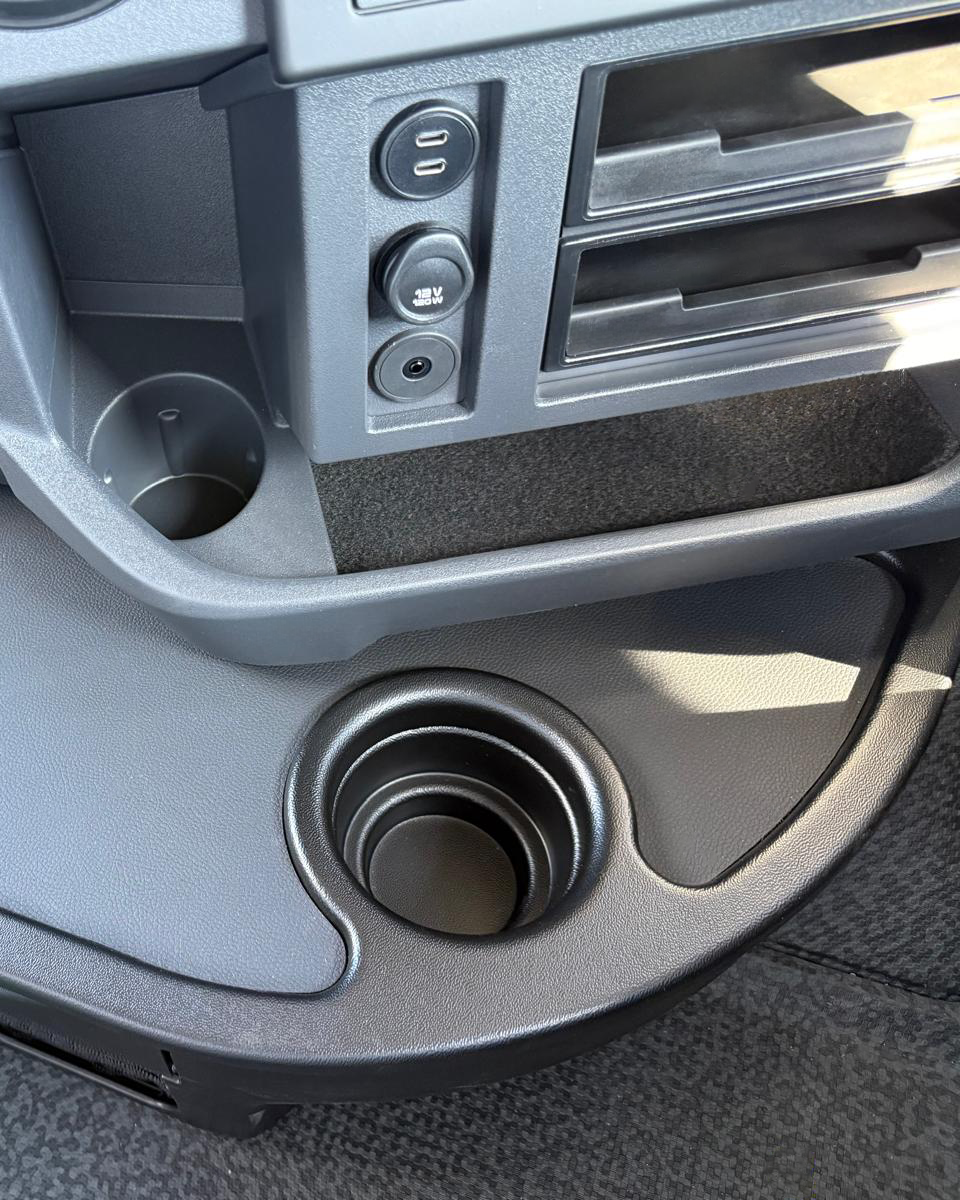 USB-C and 12V power sockets with storage and cup holders inside Renault Trucks T High 520